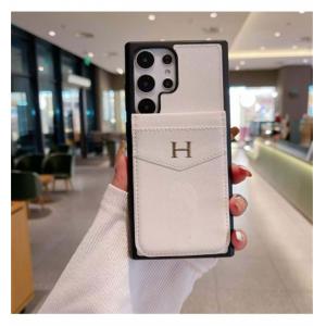 エルメス HERMES エレガントカードポケット付き Hロゴ iPhoneケース iPhone 14/15/16 Pro Max対応 ホワイト＆ブラック 高品質 新作 ファッション IPHONE16 PRO MAX14 PRO MAX 15 16ケース ブランド アイフォン15 16ケースファッション 全機種対応